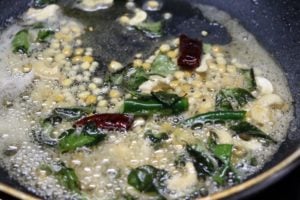 Frying mustard seeds, urad dal and chana dal in oil