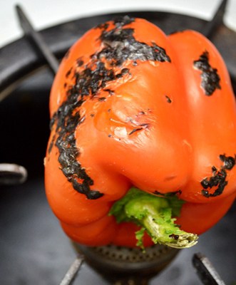 Flame roasting red pepper for soup