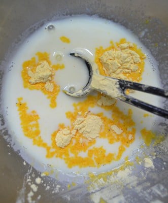 Mixing custard powder in milk for making fruit custard recipe