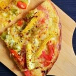A slice of vegetarian thin crust pizza made instantly