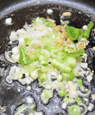 Sauteing onions for chilli baby corn recipe