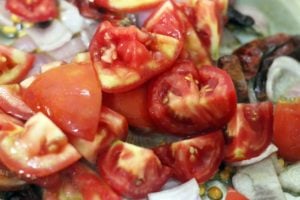 tomatoes added to sautéed onions