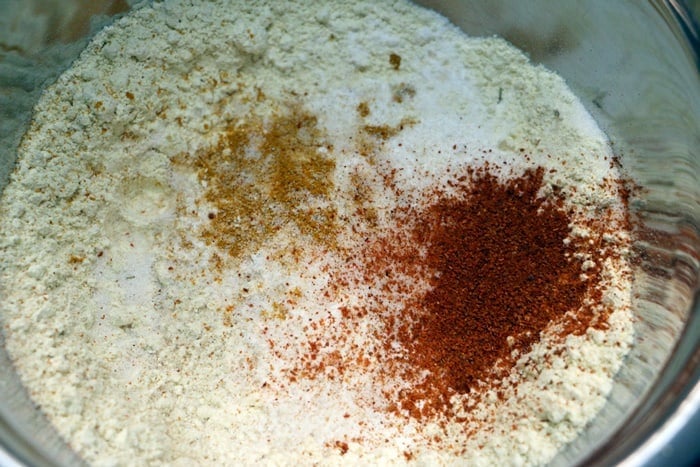 besan or chickpea flour, rice flour and spice powders in a bowl