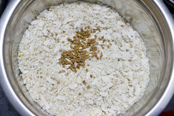 raw rice, parboiled rice, methi seeds, poha, chana dal in a mixing bowl.