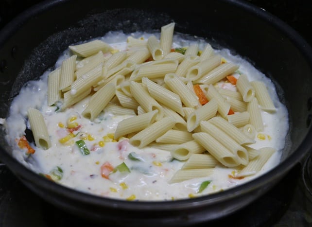 al dente pasta added to cooked bechamel sauce
