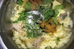 mashed potatoes mixed with spices and herbs for aloo paratha filling