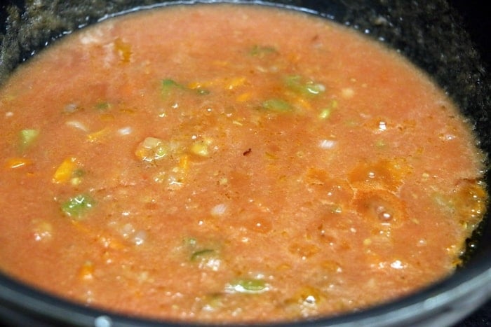 Preparing red sauce for pasta