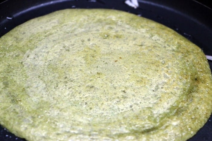 Preparing moong dal dosa