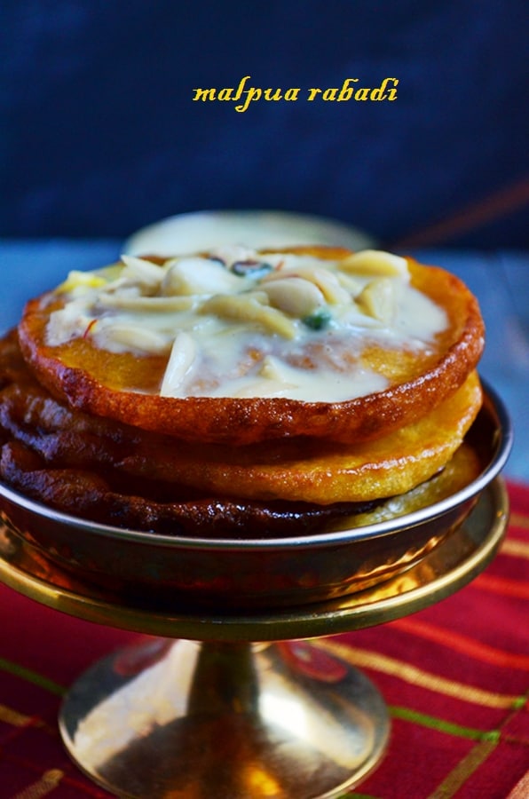 Malpua recipe is a traditional Indian sweet which is basically a sweet deep fried pancake dunked in sugar syrup and served with sweet thickened milk.