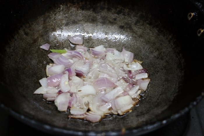 sauteing onions for making aloo capsicum recipe
