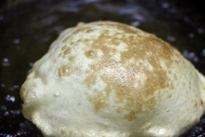 frying bhatura in hot oil