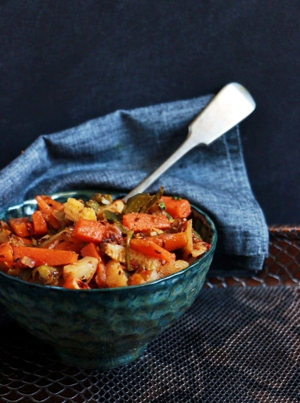 Mix veg recipe served in a green bowl with a spoon for lunch