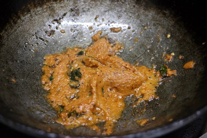 mixing onion chutney with tempering