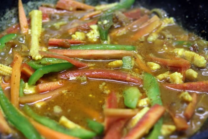 Making vegetable jalfrezi curry