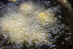 deep frying paneer pakora in hot oil