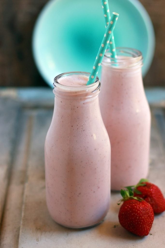 Strawberry Milkshake served in small bottle with green straw