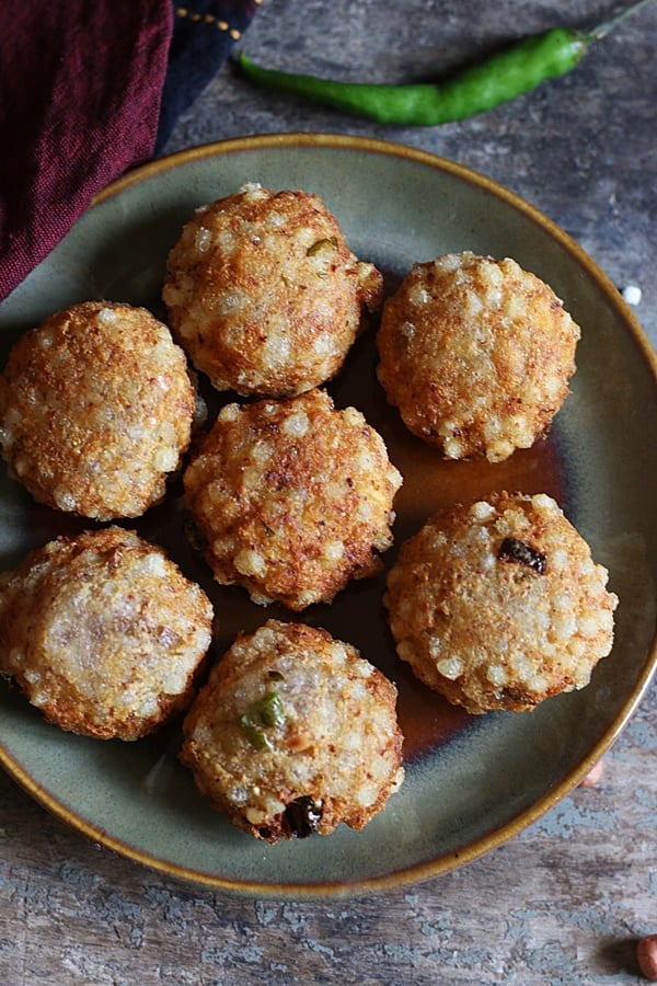 Fresh homemade crispy sabudana vada served in a ceramic plate.