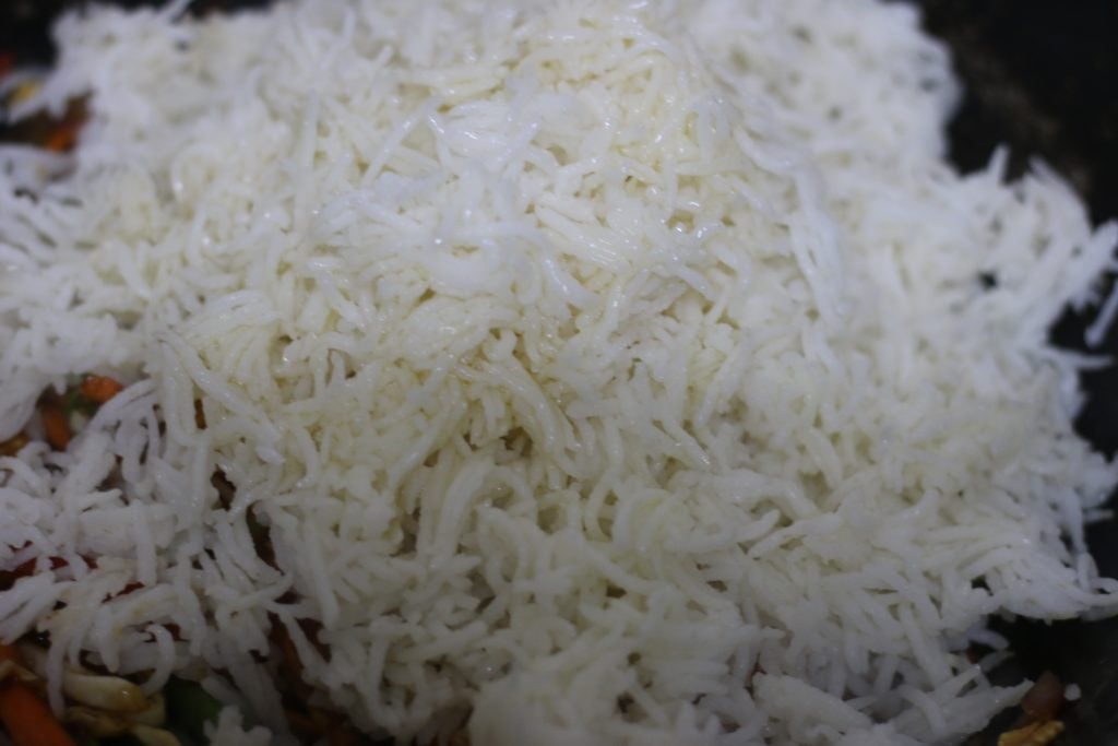 cooked rice added to vegetables