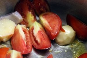 sautéing tomatoes, potatoes and beetroot in olive oil.