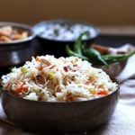 This veg pulao recipe is delicious, easy and gives you the perfect restaurant style veg pulao every single time. You can make this pilaf very easily for a crowd. With a chockablock of veggies and mild spices, this vegetable pulao will easi;y be the star of any feast!