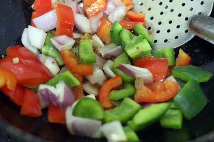 sauteing onions and capsicum for paneer chilli