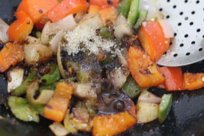 soy sauce, sugar, chili sauce, vinegar added to sauteed vegetables