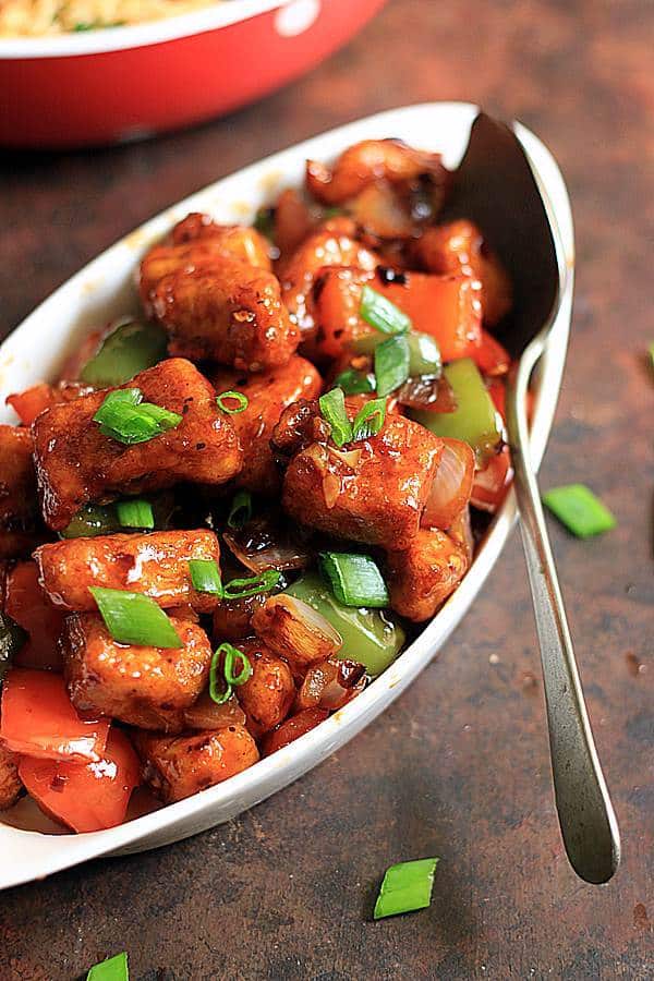 Chilli paneer in a white bowl