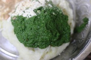 mixing spinach paste with mashed potatoes
