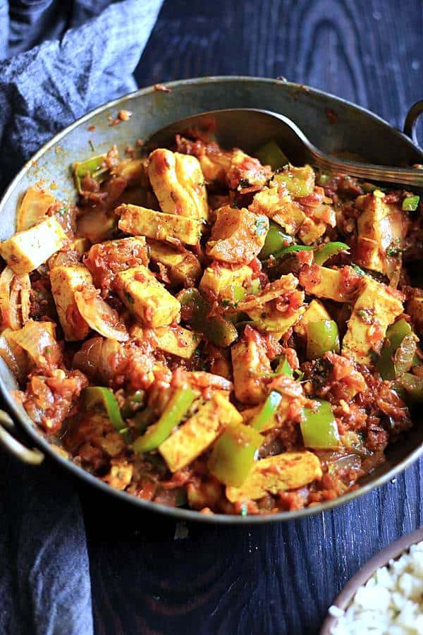 delicious semi dry kadai paneer served in a copper pan