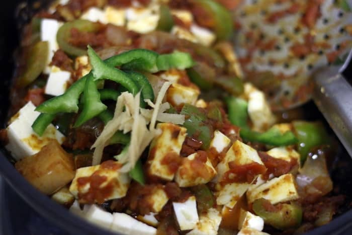 kadai paneer garnished with ginger julienne