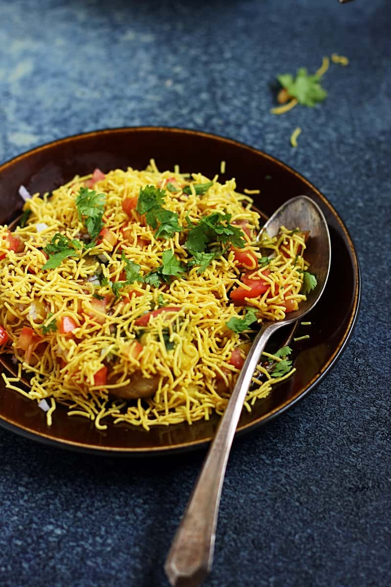 Closeup shot of Mumbai special ragda patties served with a spoon