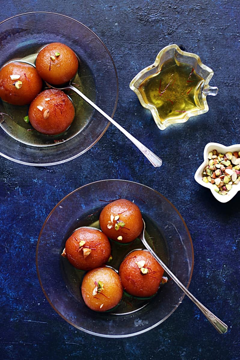 overhead shot of makkan peda with sugar syrup served for dessert