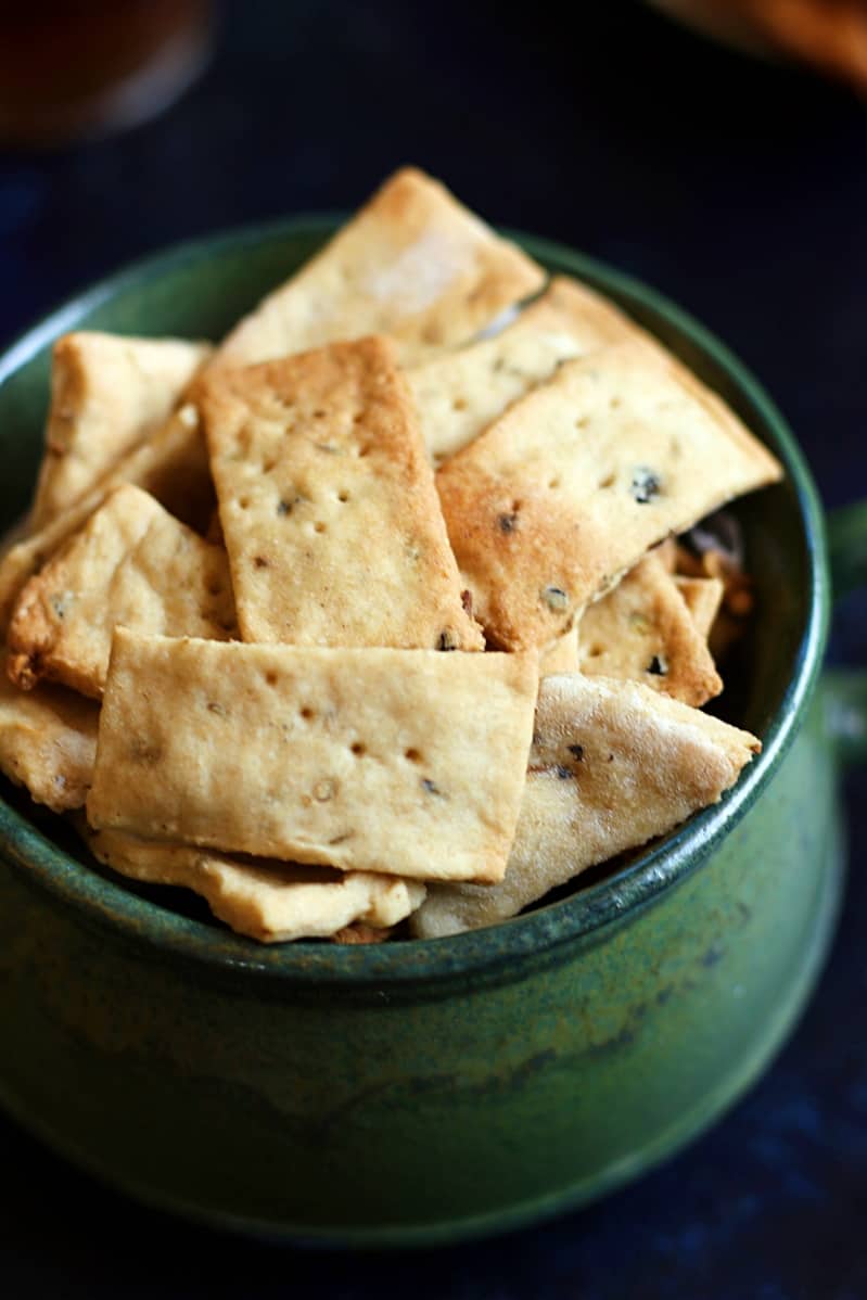 Closeup shot of crispy namak pare in a green cup