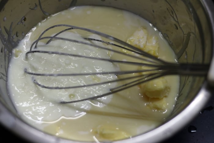 mixing wet ingredients for making honey cake recipe