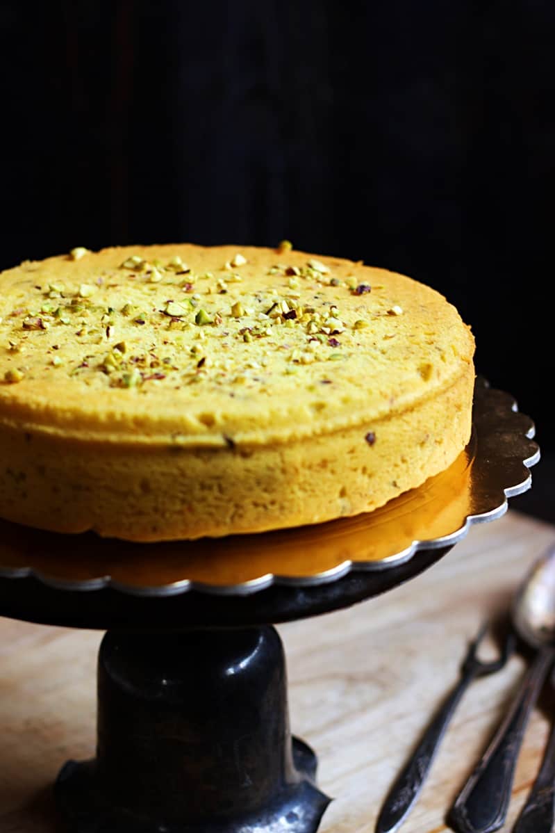 easy eggless parsi mawa cake served in a cake board