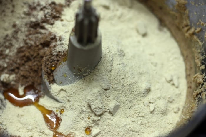 powdered sugar, cocoa powder and oil added to hazelnut butter for making nutella 