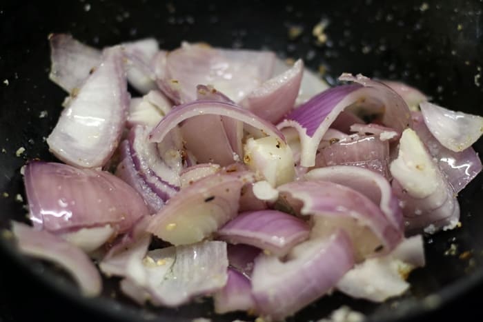 Sauteing onions for making bharli vangi recipe