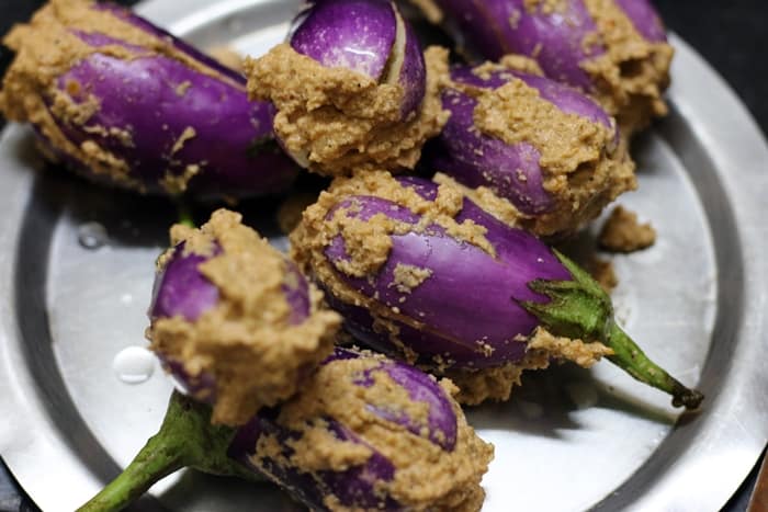 Eggplants stuffed with spice paste for making bharli vangi recipe