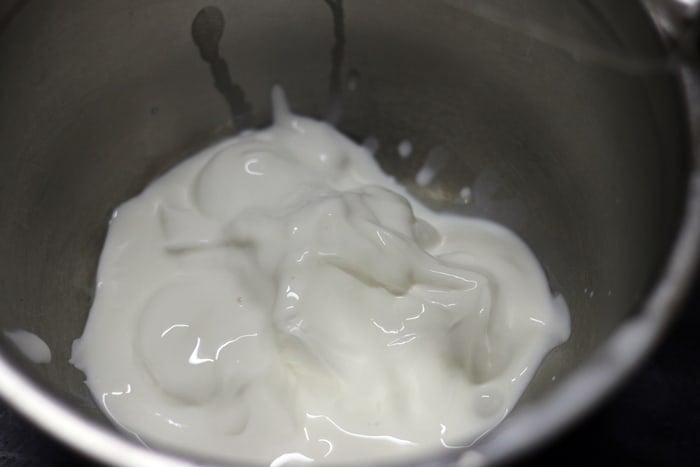 chilled heavy cream in a mixing bowl