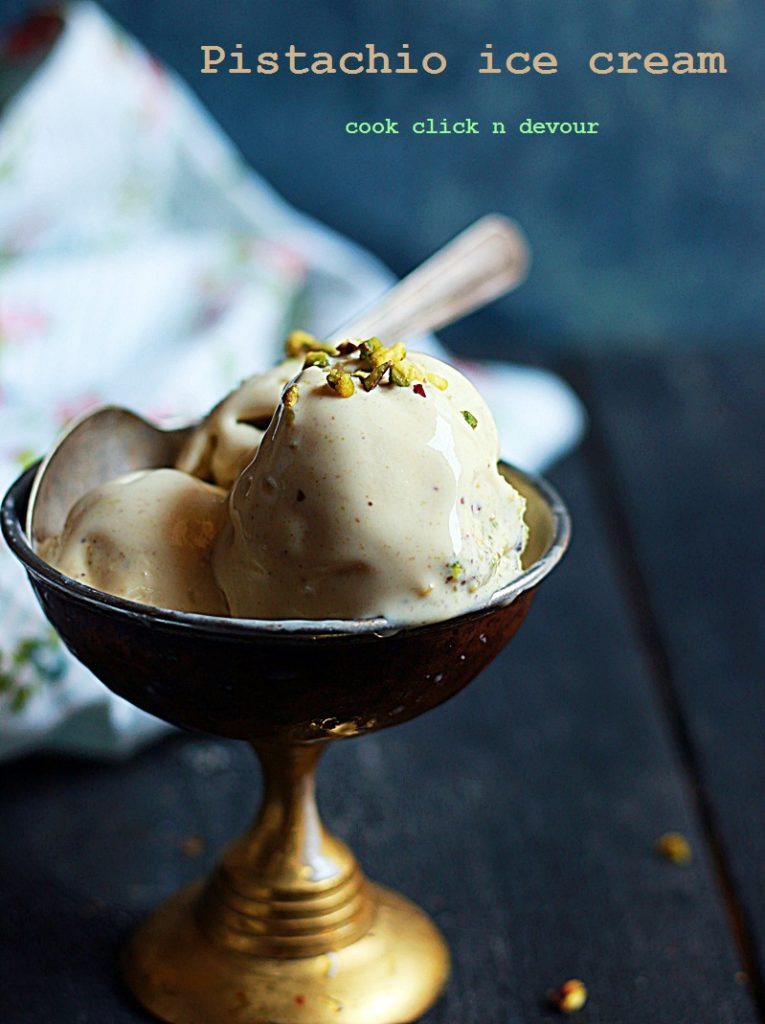 Homemade pistachio ice cream served in a copper ice cream bowl with a spoon
