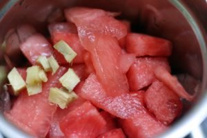 chopped ginger and cubed watermelon in a mixer jar