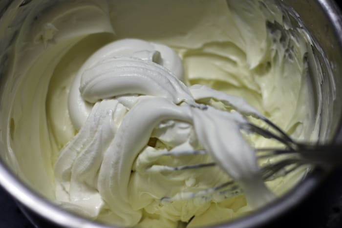 Fresh cream added to whisked cream