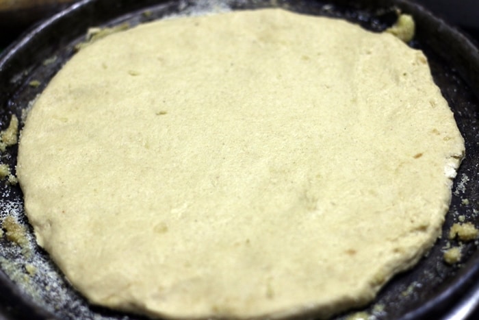 preparing base for white sauce pizza recipe