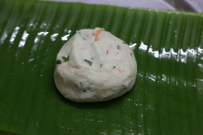 Akki roti dough ball placed on banana leaf