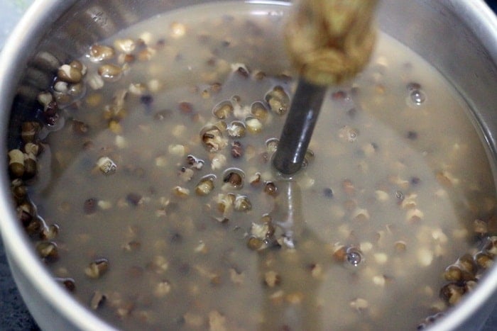 mashing and simmering lentils