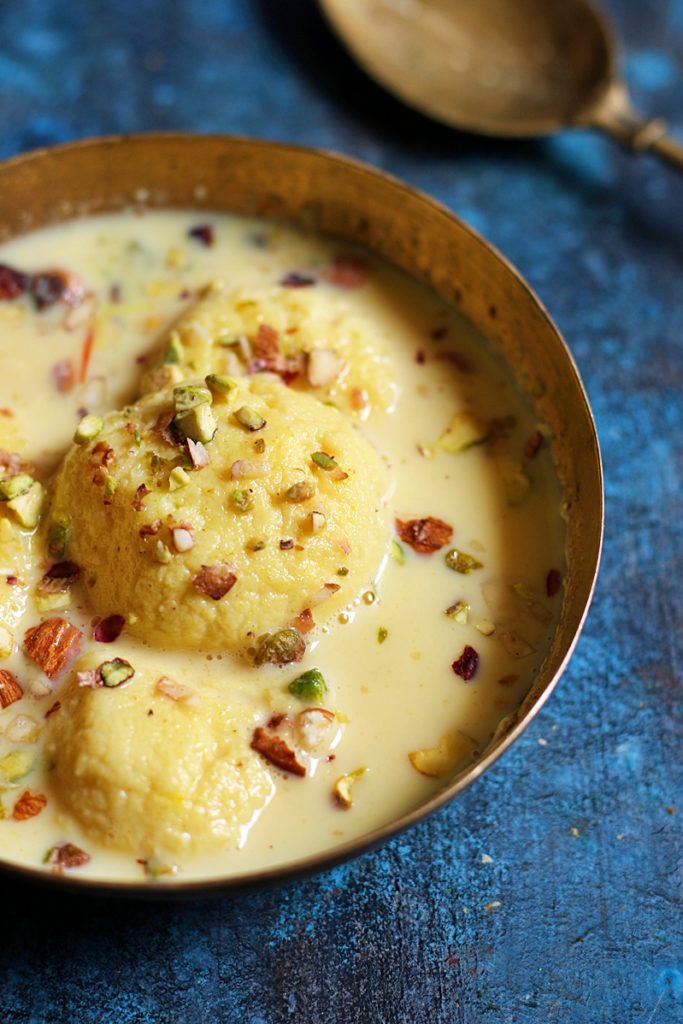 Easy rasmalai garnished with nuts served chilled for dessert