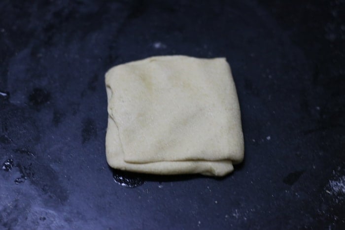 square shaped paratha ready to be rolled