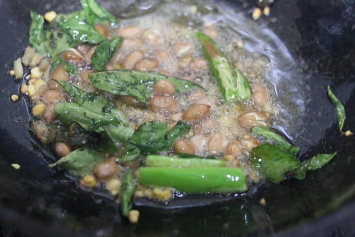 sauteing peanuts for tomato rice