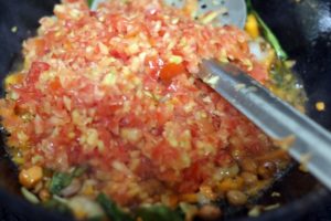 minced tomatoes added to make tomato rice recipe
