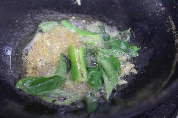 curry leaves added to the tempering of thakkali sadam